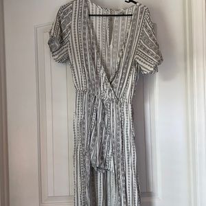 Romper/jumpsuit with skirt in back